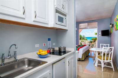 Dining table by the Kitchen area in Studio Garden Pool View room at Dover Beach Hotel
