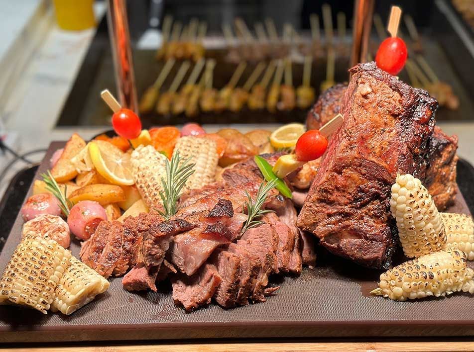 Close-up of a steak platter served with a side of corn at Imperial Lexis best Malaysian Restaurants Kuala Lumpur