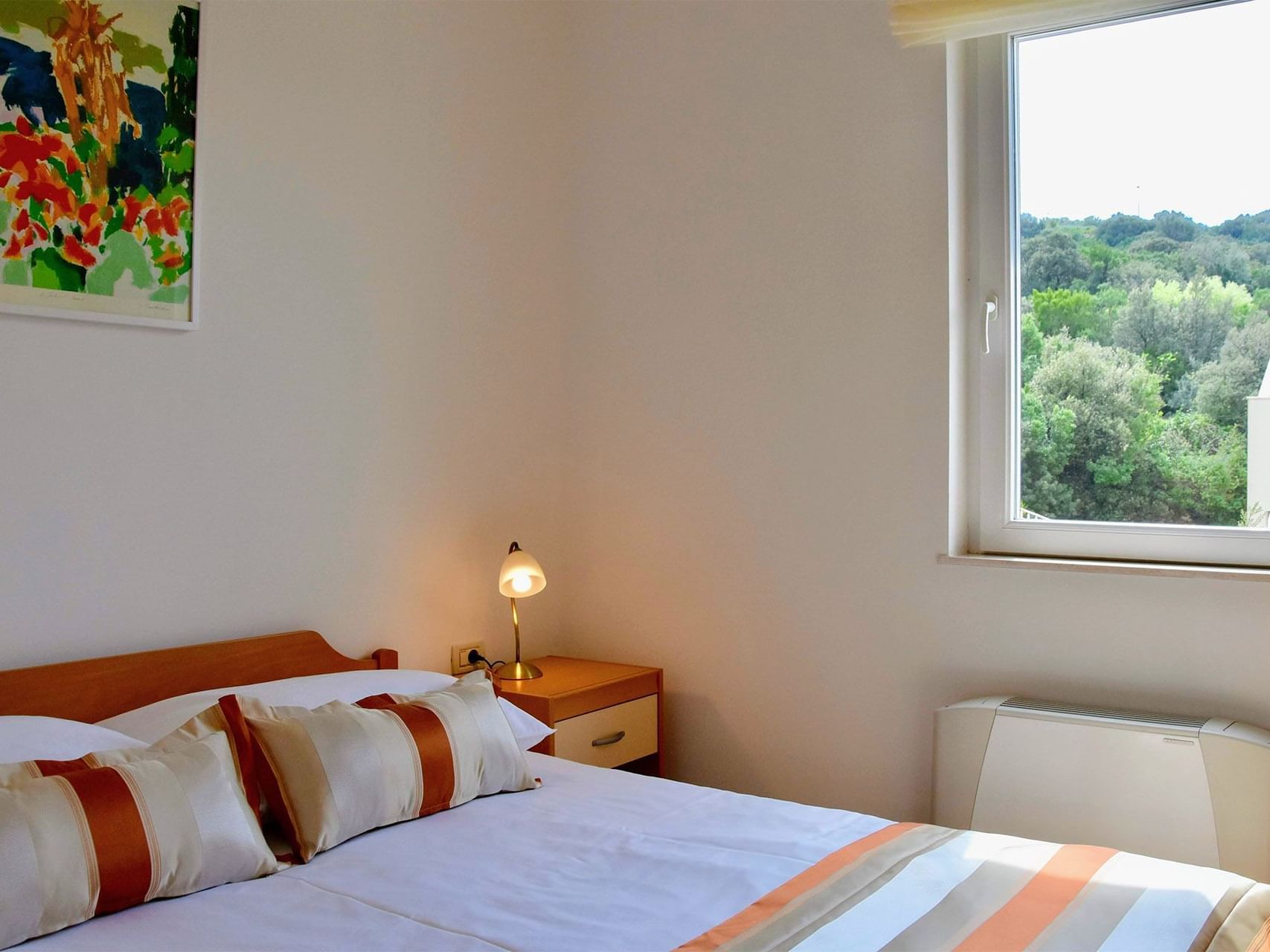King bed in Two-bedroom Apartment at Pervanovo Apartments