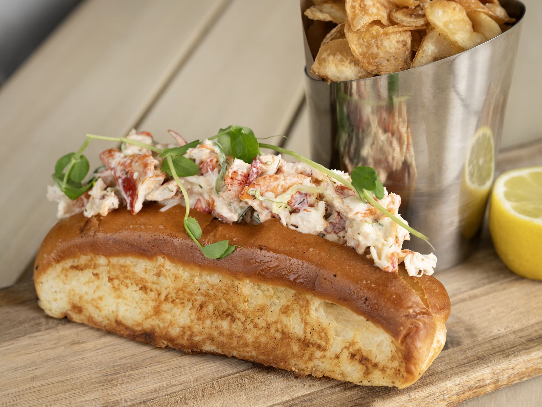 Poached lobster, seaweed salad, watermelon radish, green apple, cucumber, dill aioli with a tin of fries