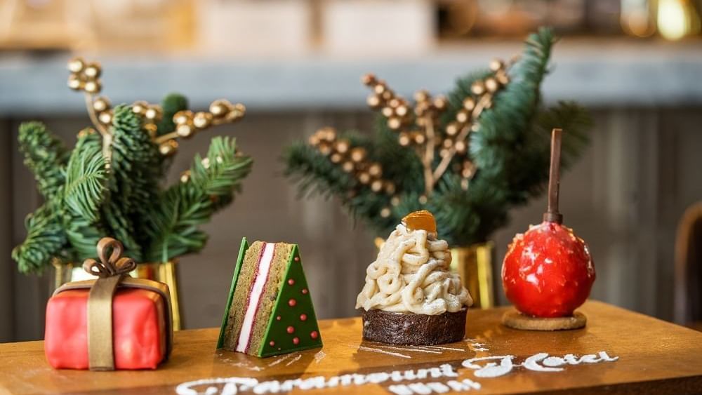 Christmas inspired sweet treats displayed on a wooden board at Paramount Hotels