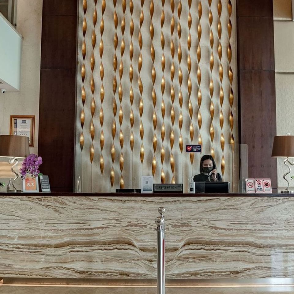 Receptionist in the front desk at LK Hotel Simpang Lima