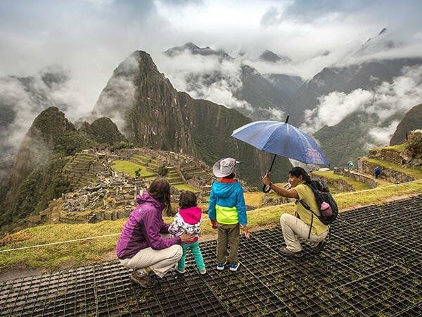 Tourists exploring Machu Picchu Mountains near Hotel Sumaq
