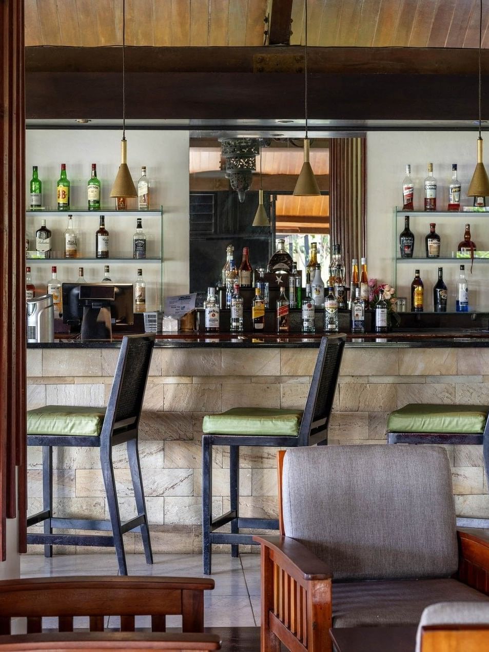 Well-stocked bar area with comfortable seating in the Lobby Bar at warwick le lagon-vanuatu