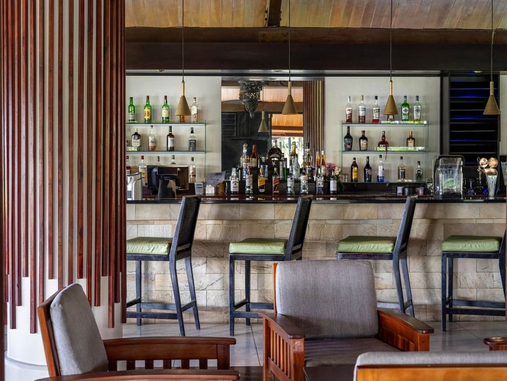 Well-stocked bar area with comfortable seating in the Lobby Bar at warwick le lagon-vanuatu