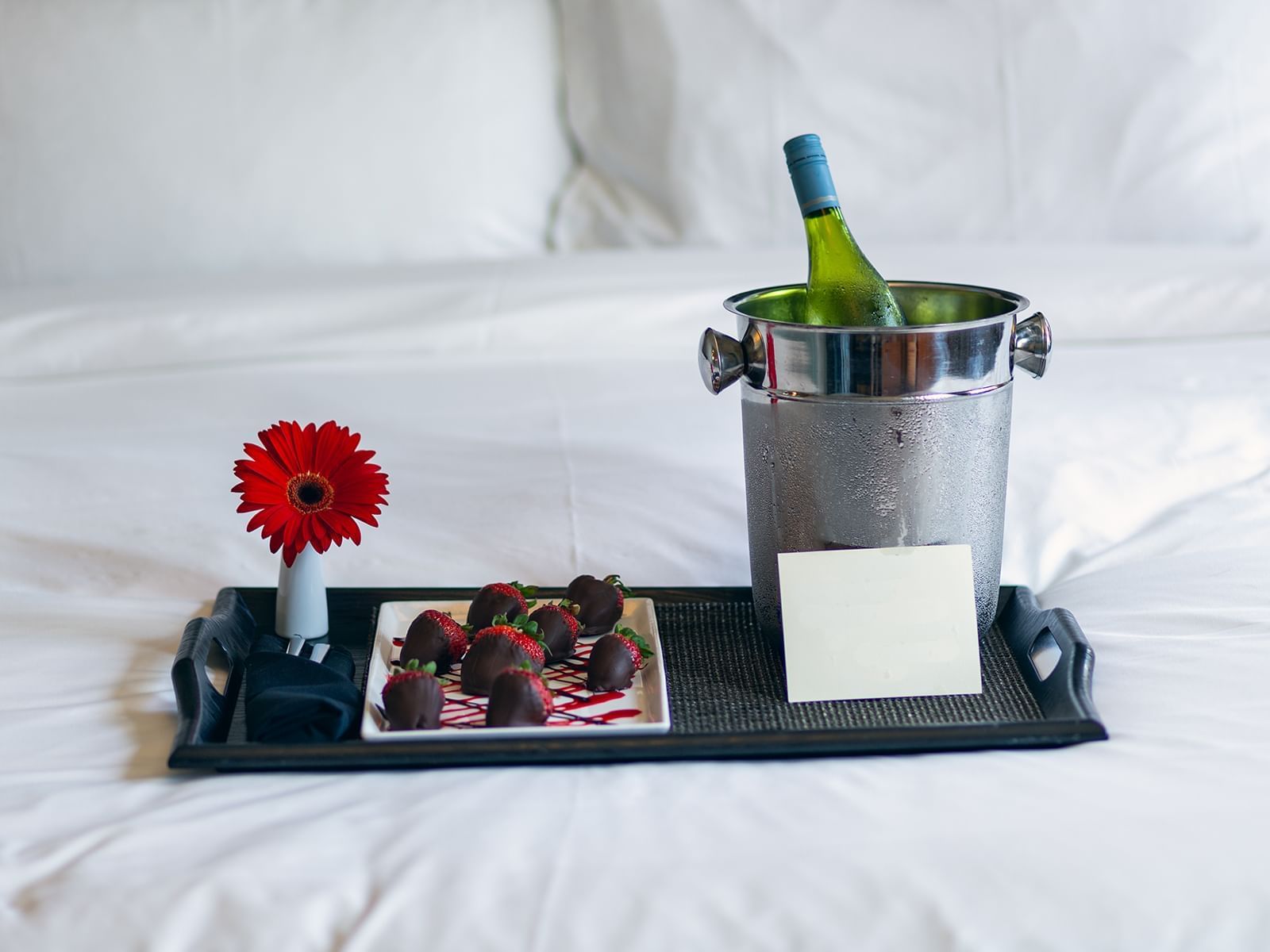 Champagne & Strawberries served on bed at Carriage House Hotel