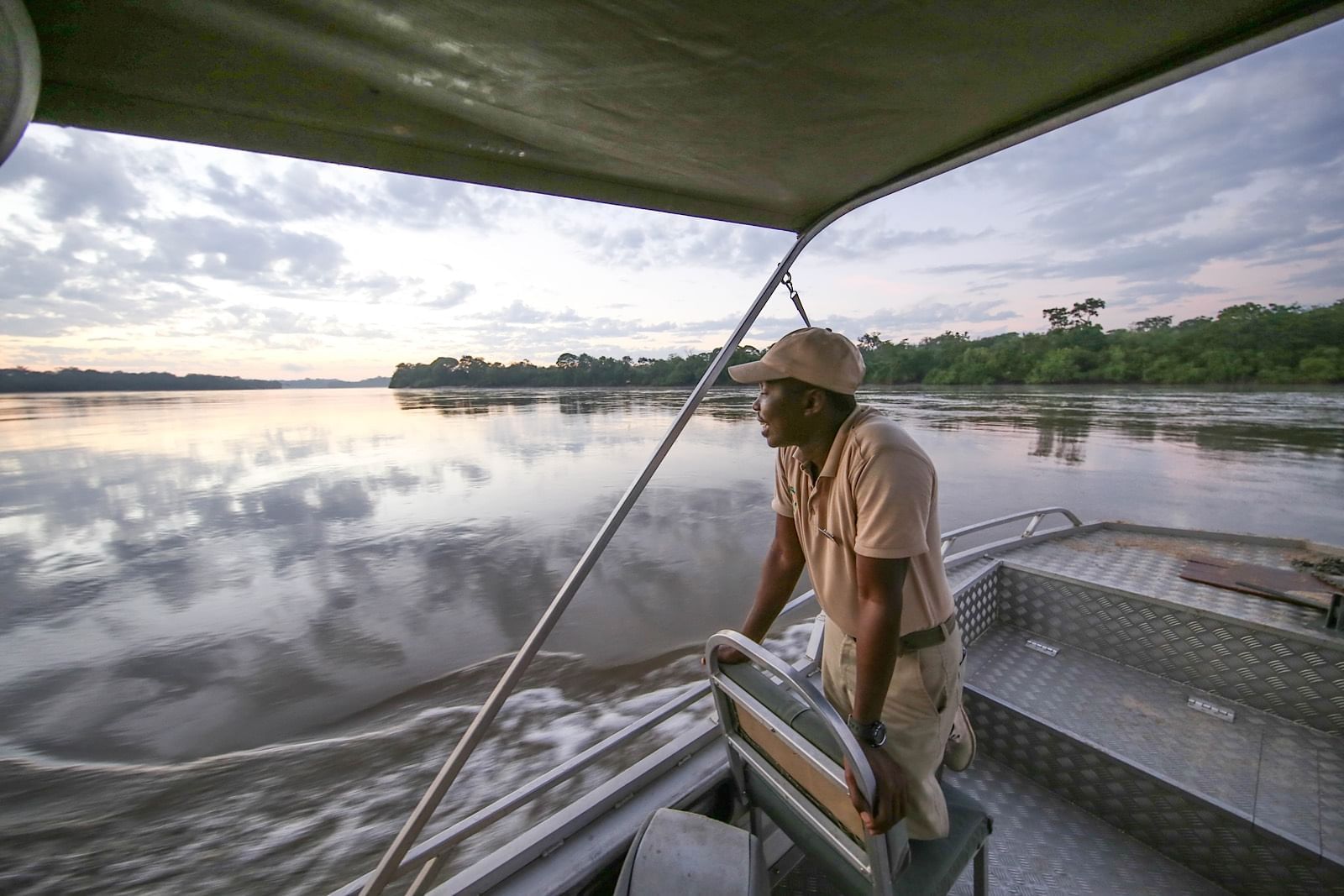 View of a sailor on a boat near Serena Mivumo River Lodge