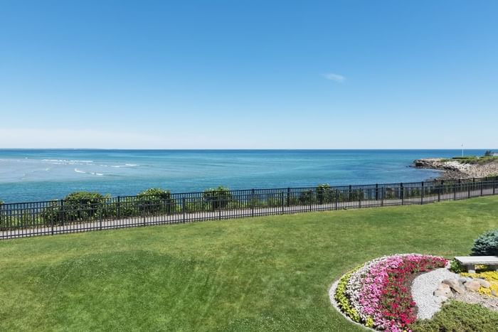 Distant view of the sea from the garden at Ogunquit Collection