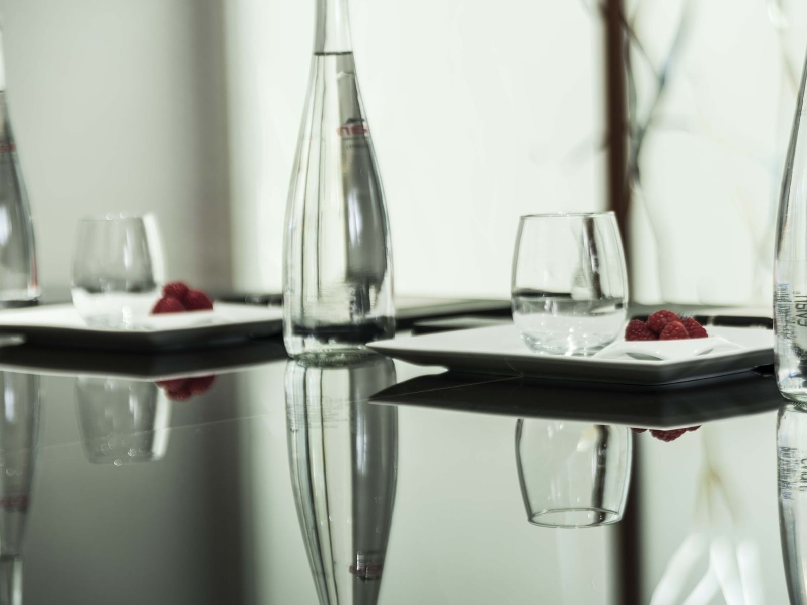 Glasses & plates arranged in dining table at Marquis Reforma