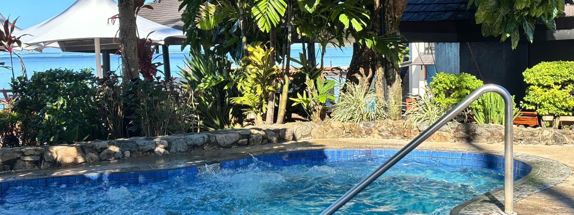 Swimming pool with handrail at Warwick Fiji Resort and Spa in Korolevu