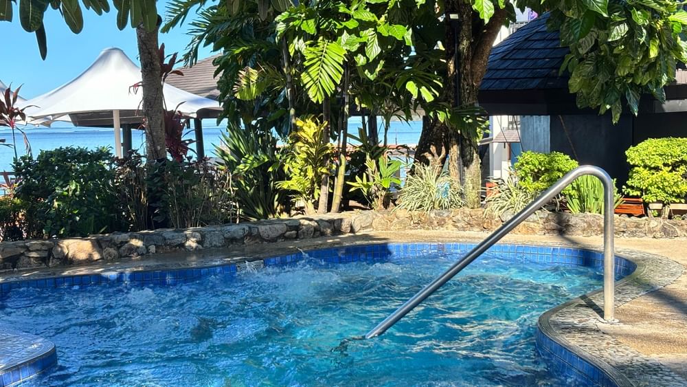 Swimming pool with handrail at Warwick Fiji Resort and Spa in Korolevu.