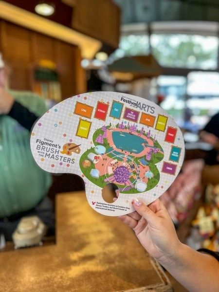 A pallete-shaped scavenger hunt souvenir at the EPCOT International Festival of the Arts.