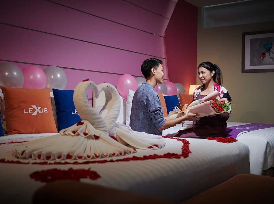 couple having romantic staycation in Lexis Hotel