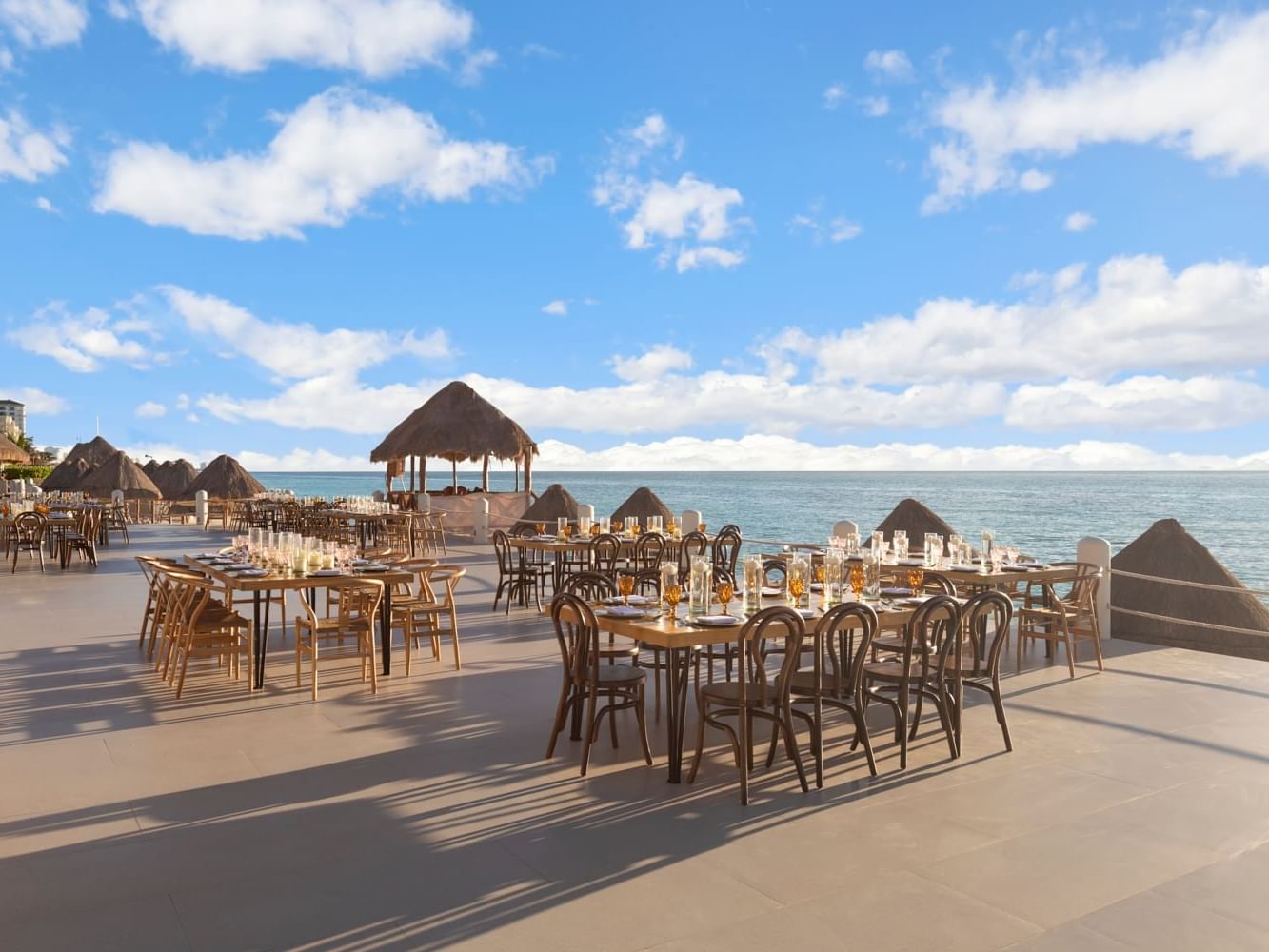 Restaurant with outdoor seating overlooking the ocean at Fiesta Americana