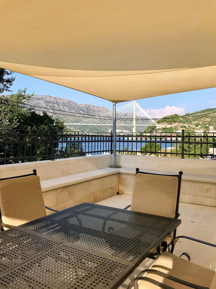 Outdoor dining and lounge area at The Villa Franica