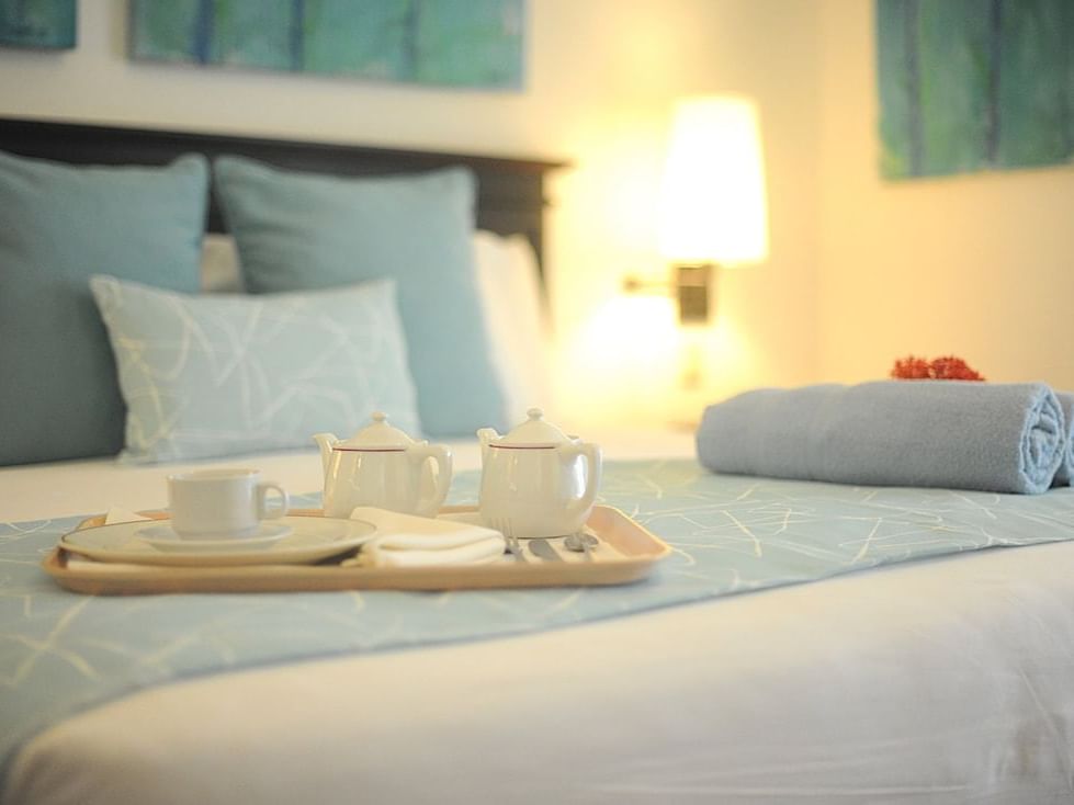 Close-up of Sadler Tea set on the bed at Blue JackTar Hotel