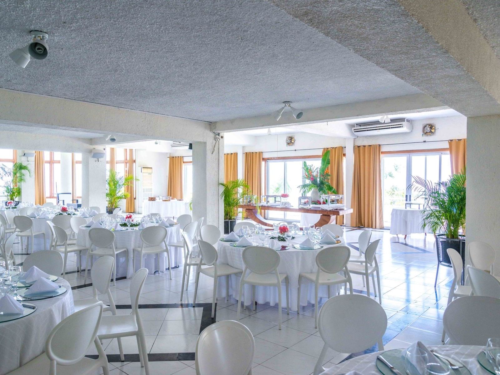 Banquet tables arranged in Horizon Room at Hotel Montana Haiti
