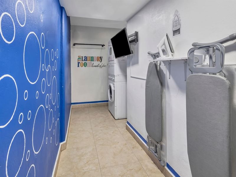 Washing machine, dryer & TV in the Laundry Room at One Hotels