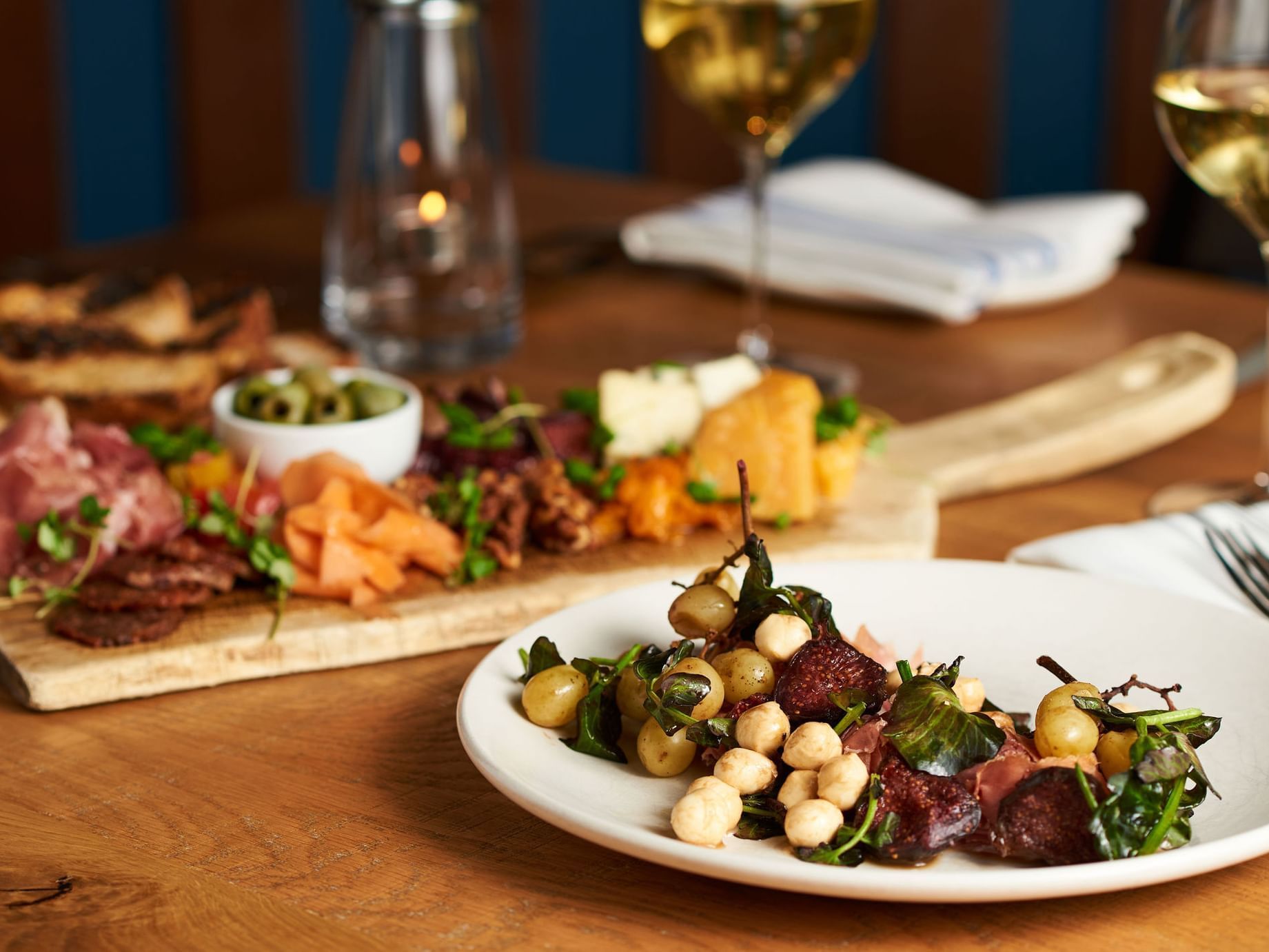 meat cheese board on table with wine