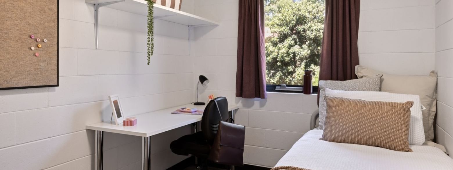 Modern bedroom with desk, chair, bed, and window at UniLodge at Curtin University - Guild House in Karawara.