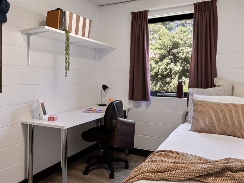 Modern bedroom with desk, chair, bed, and window at UniLodge at Curtin University - Guild House in Karawara.