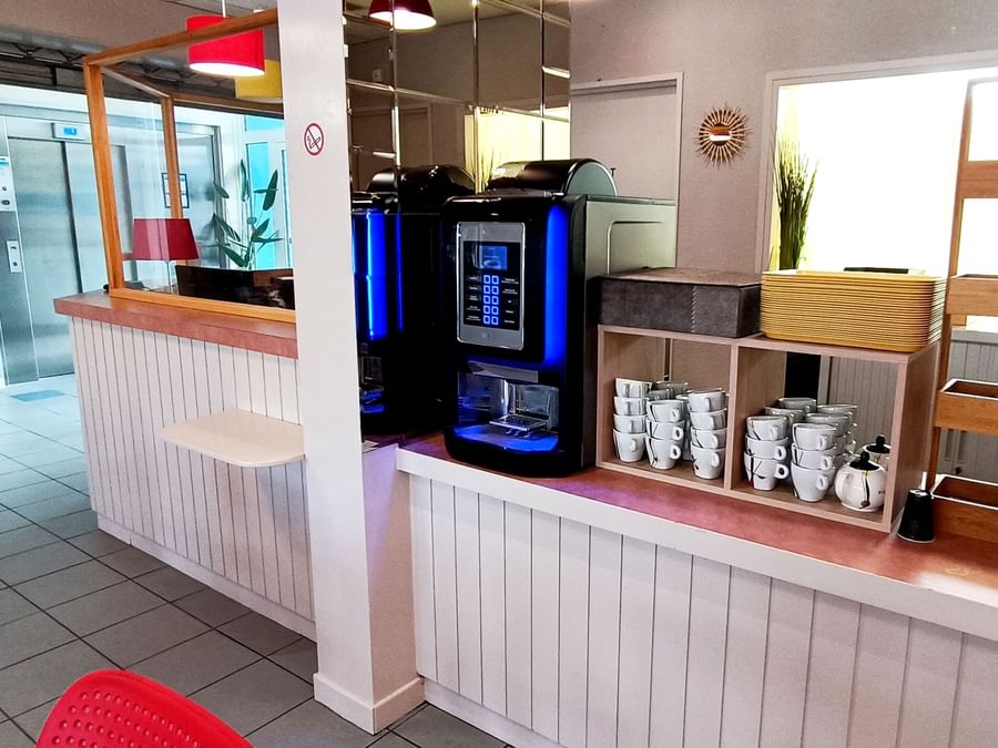 Self-service coffee machine in restaurant at Originals Hotels