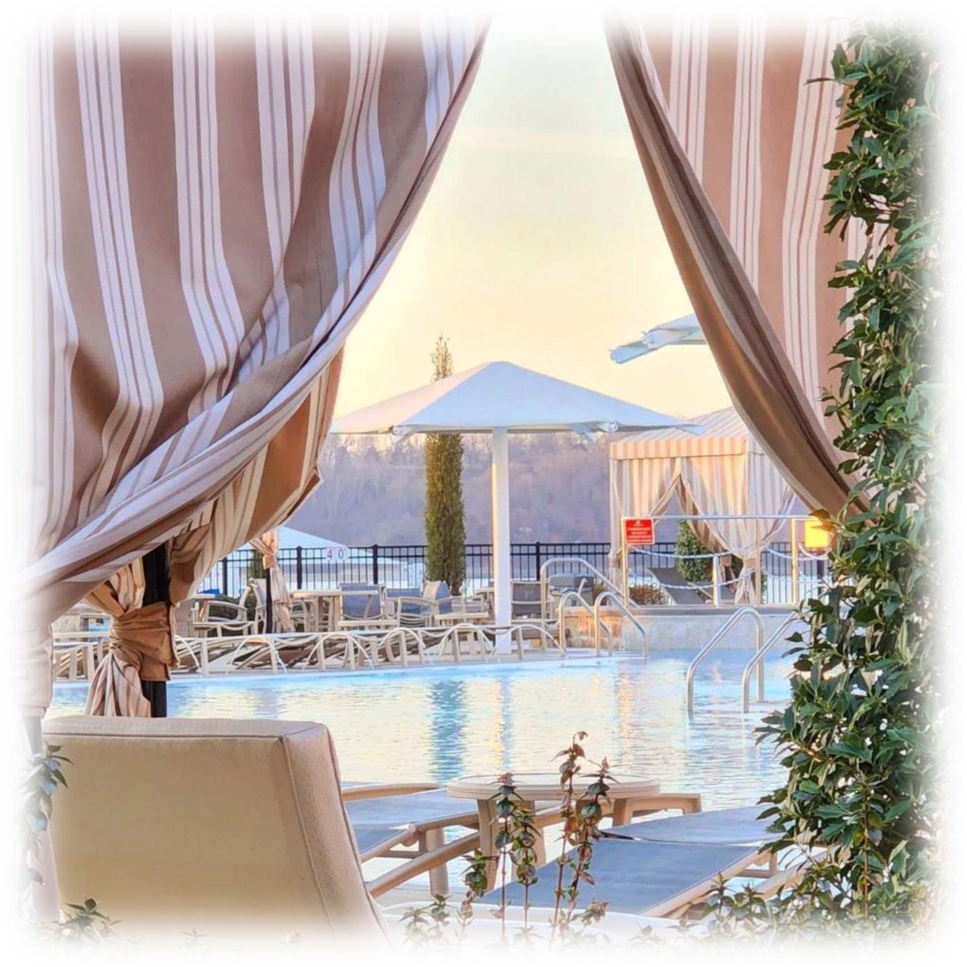 Swimming pool with cabanas and lounge chairs, offering relaxation and lake views at Shangri-La Monkey Island