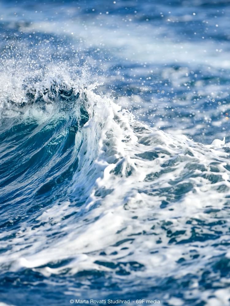 Close-up of beach waves on a sunny day near Almanac Barcelona