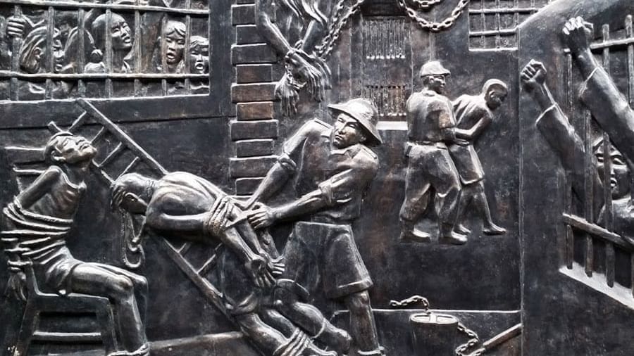 Carvings of prisoners on the walls in Hoa Lo Prison near Sunway Hotel Hanoi