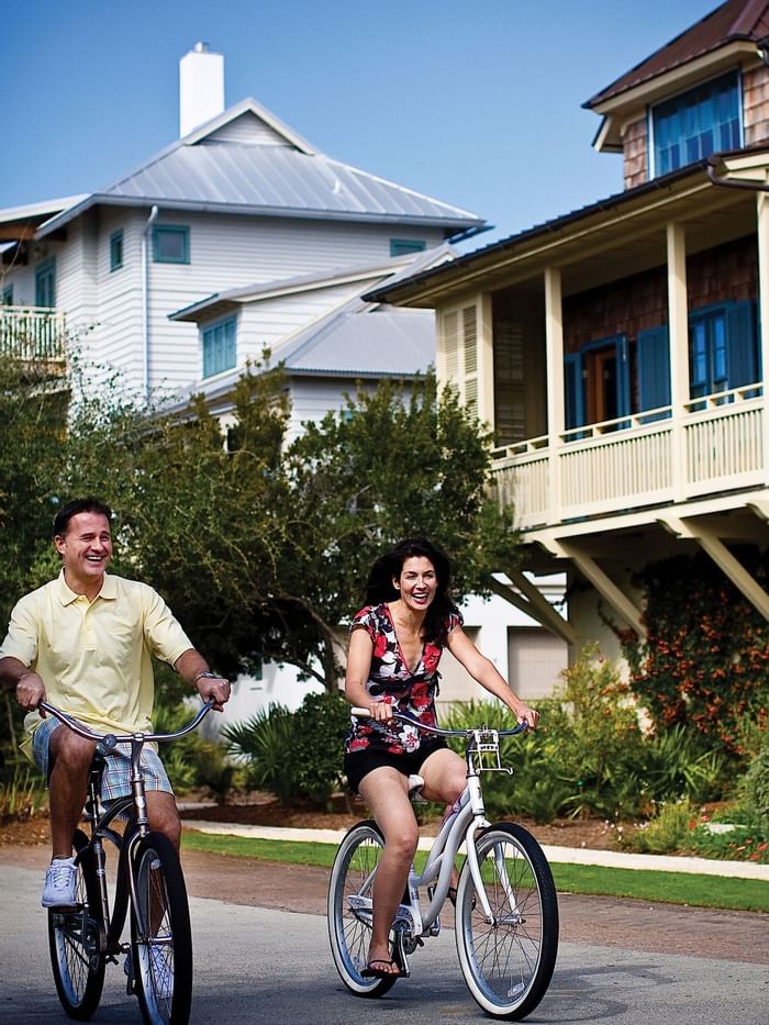 Couple riding on bicycles at Watersound Inn