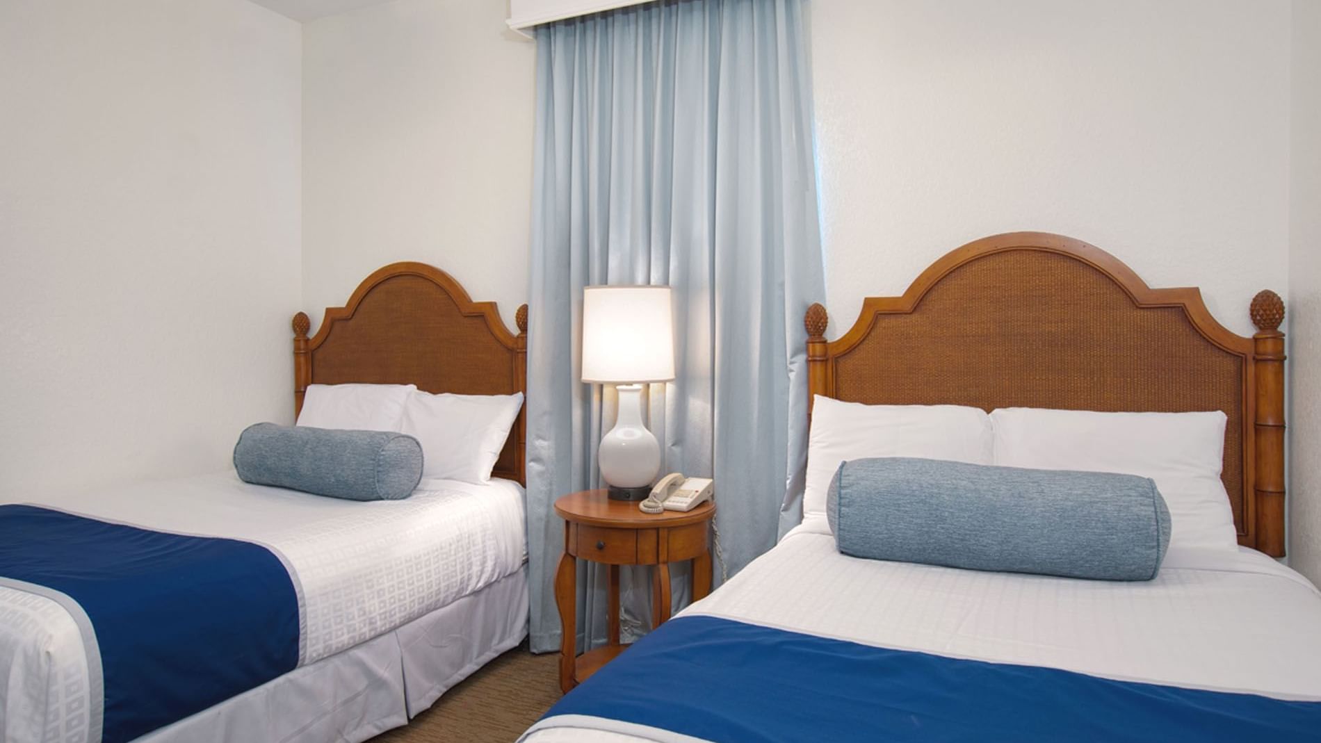 Two cozy beds & nightstand in 3 Bedroom 2 Bath Suite at Lake Buena Vista Resort Village & Spa