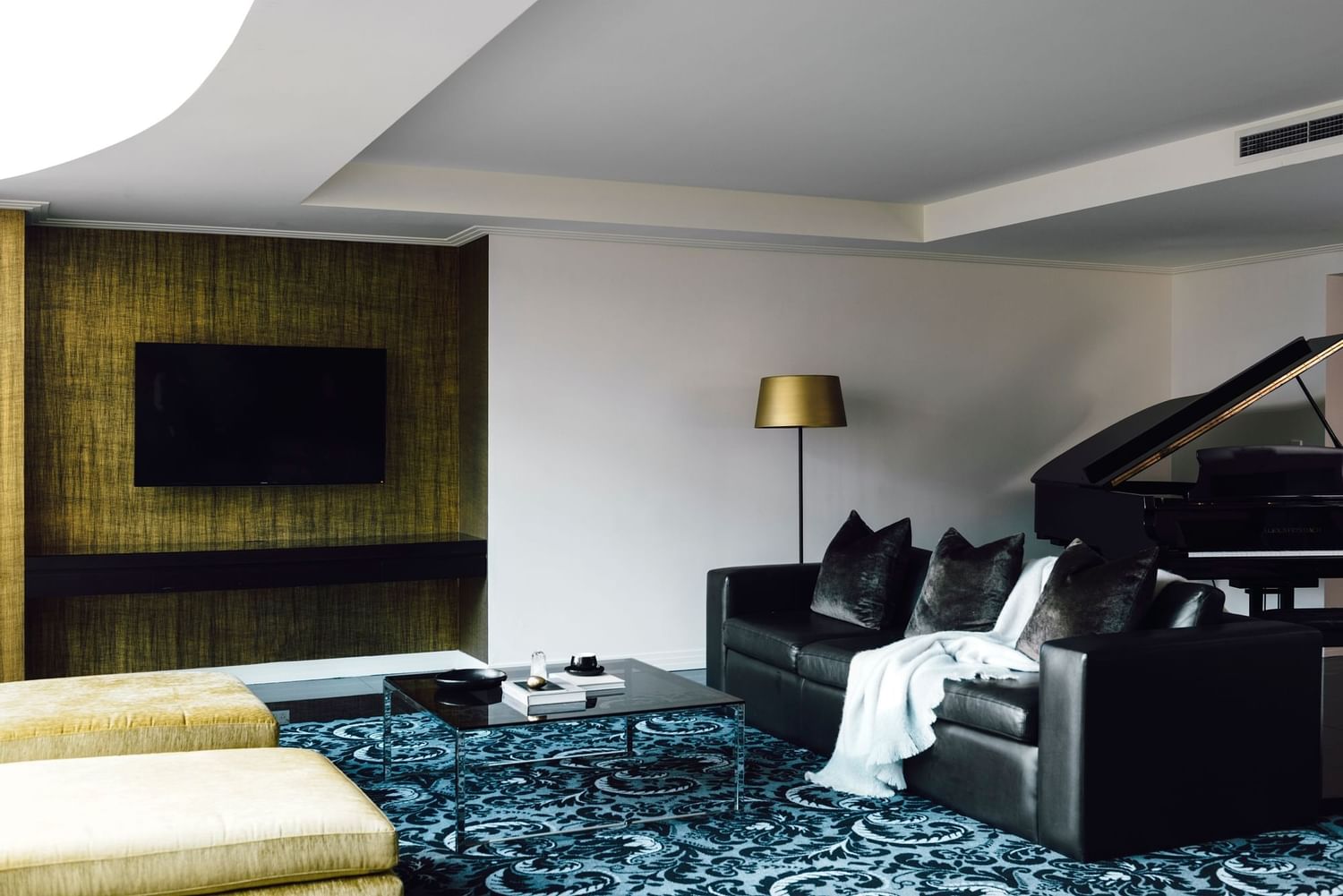 Piano & TV in Gold Penthouse lounge area at Como Melbourne