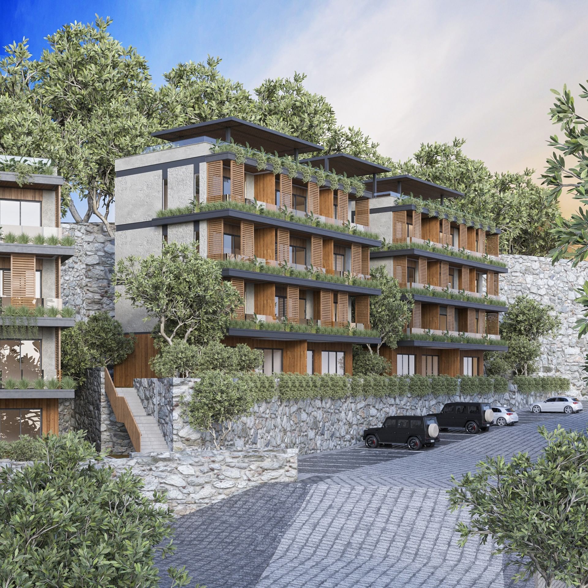 Hillside BlueZone Residence with terraced floors, stone walls, and a parking lot with luxury SUVs at A'ila Residences