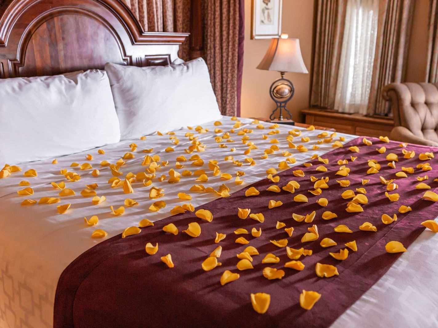 Flower petals on a bed at The Herrington Inn & Spa