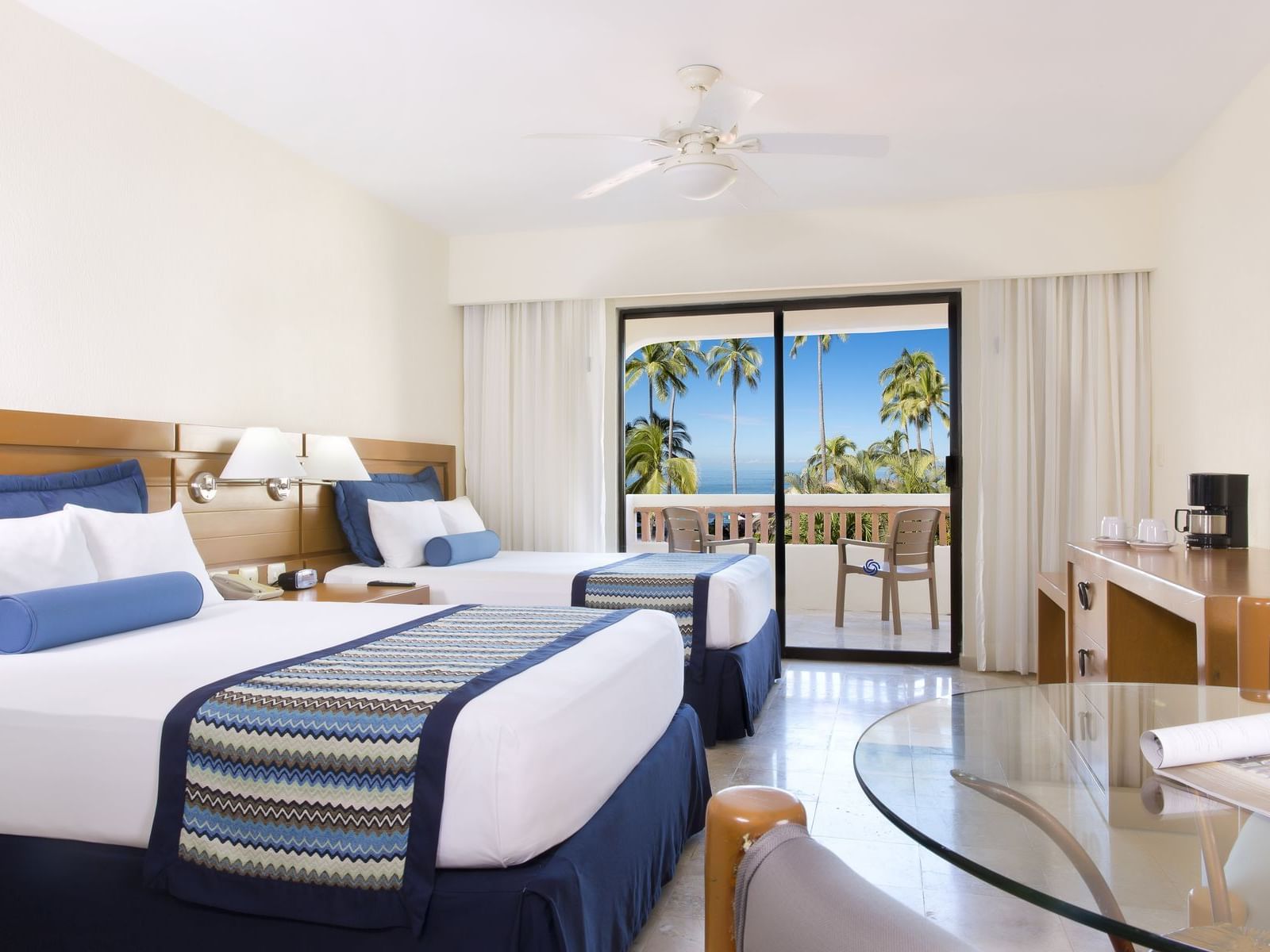 ILUMINATED ROOM OF TWO DOUBLE BEDS