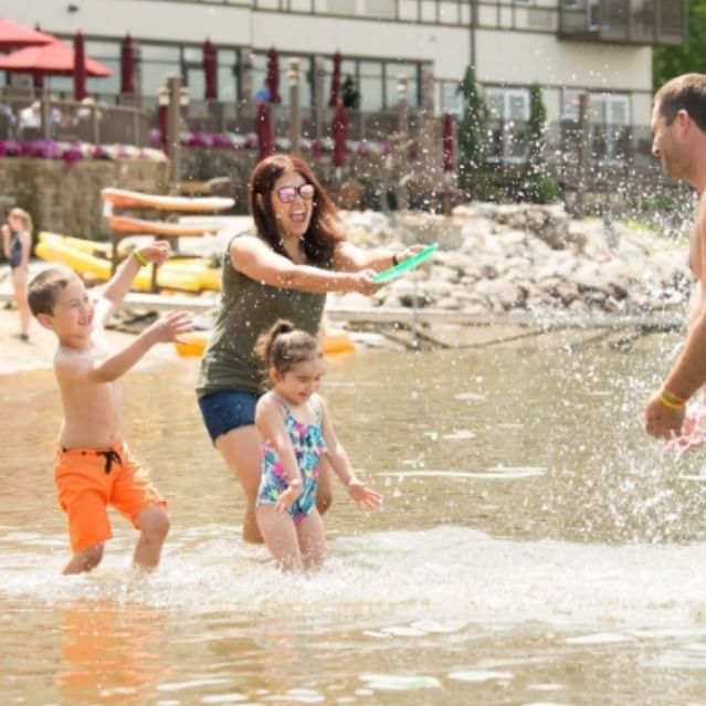 Family enjoying in the beach at Chase on The Lake