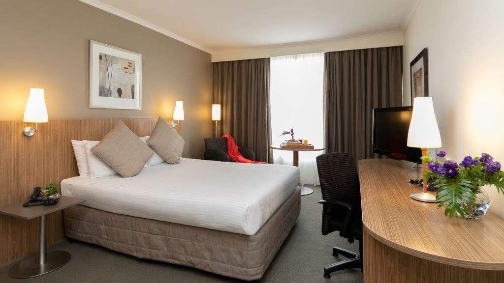 Queen bed in a Standard Queen room at Mercure Sydney Parramatta