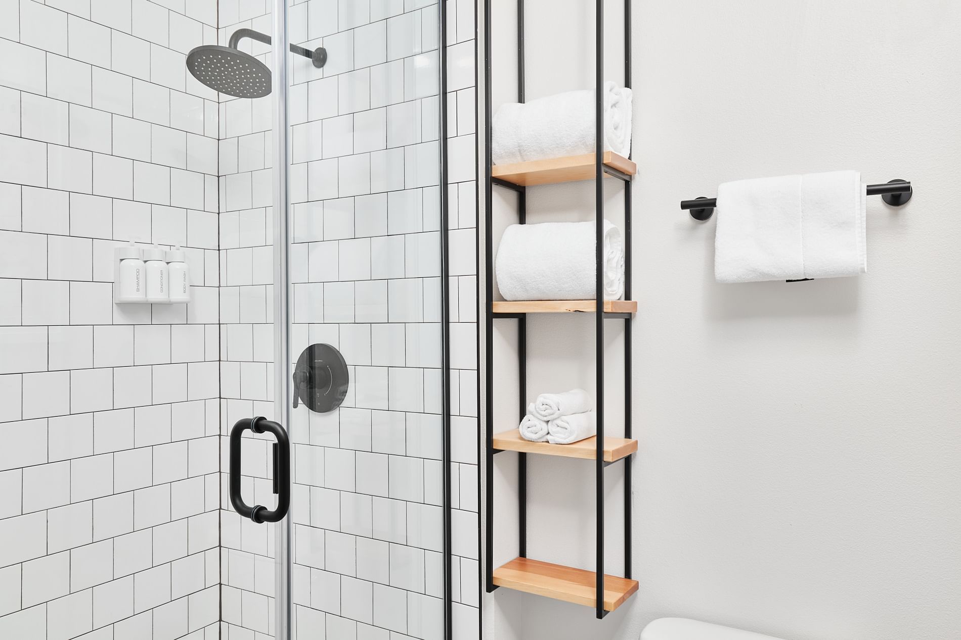 Shower & towel rack in junior suite bathroom at Kinship Landing