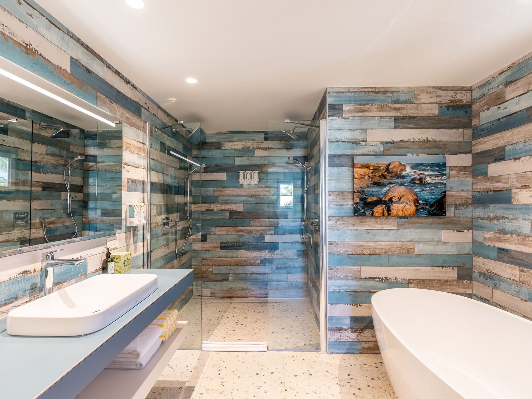 Bathtub & shower with vanity in Honeymoon Suite at Passions on the Beach