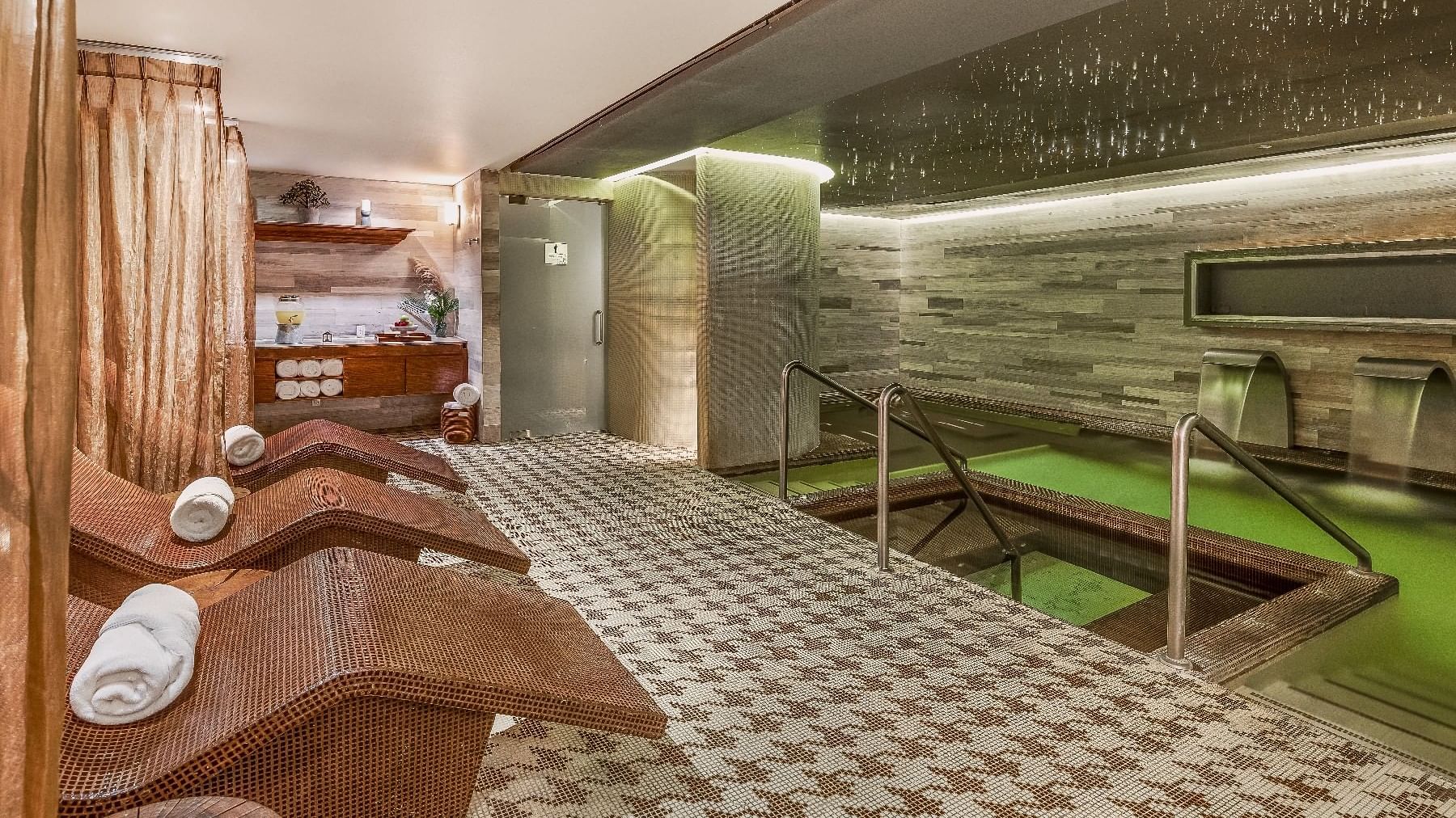 Spa room featuring a green pool & wooden benches at Live Aqua Ciudad de México Bosques de las Lomas