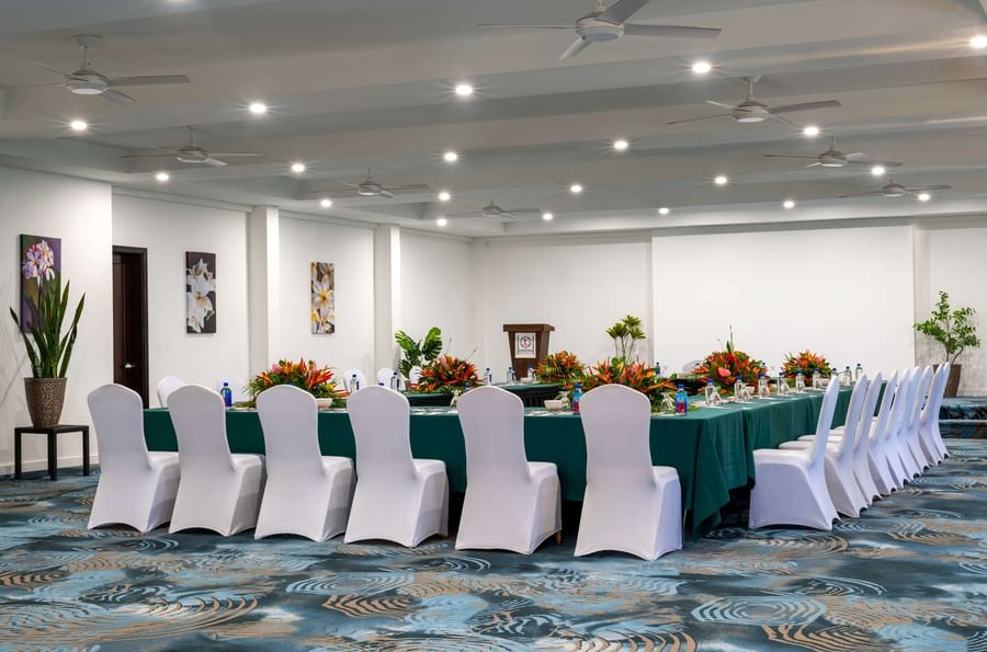 Long table with green cloth and white chairs at Tokatoka Resort - Fiji International Airport.