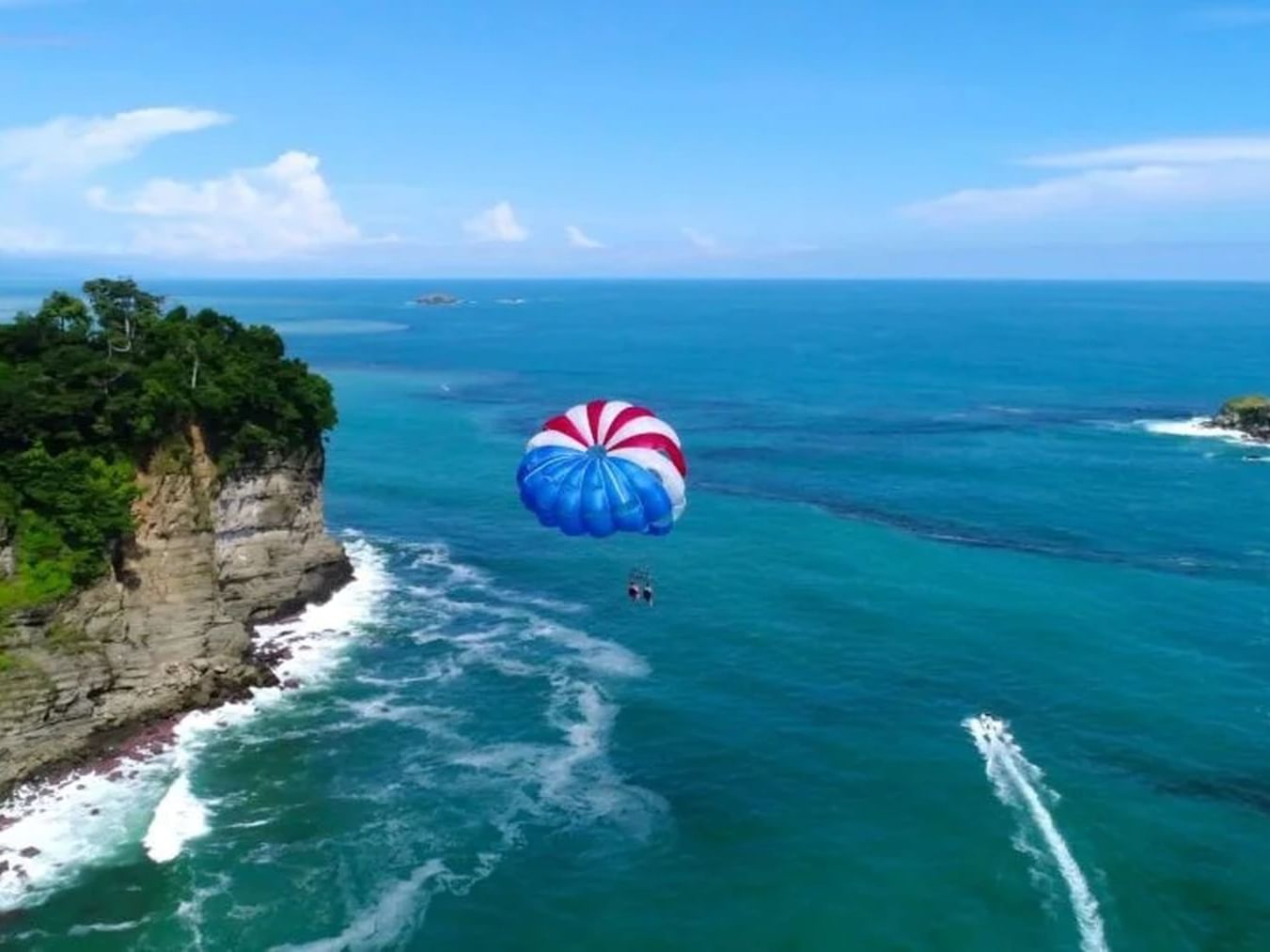 Parasailing experience over the sea near Jungle Vista Boutique Hotel