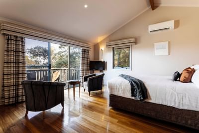 Interior of Premier Spa Cabin bedroom overlooking the view at Freycinet Lodge