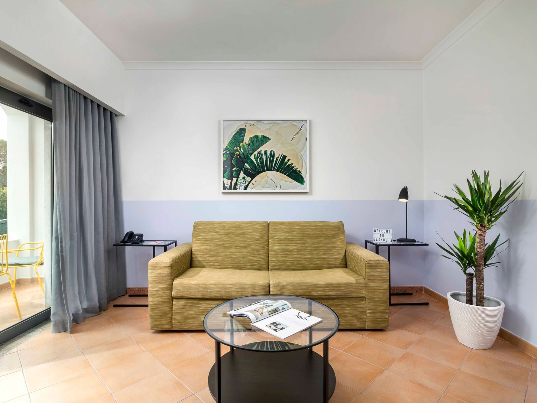 Living area with sofas & tables at The Magnolia Hotel