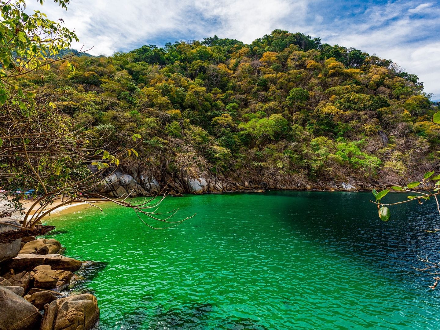 Colomitos Beach with emerald water and rocky formations near Plaza Pelicanos Club Beach Resort