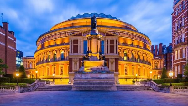 Royal Albert Hall illuminated by warm golden lights at night near The Capital Hotel, Apartments and Townhouse