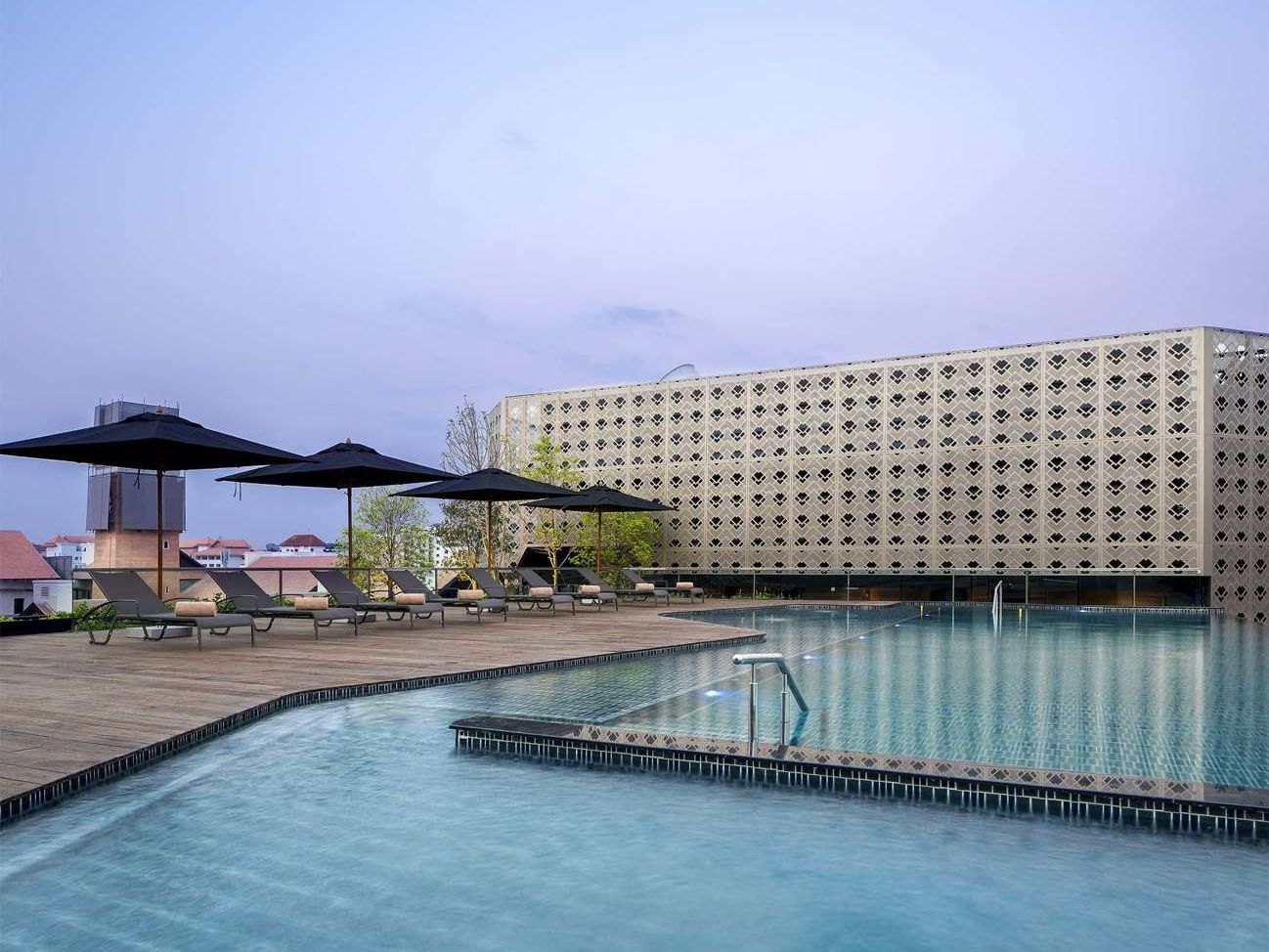 Swimming Pool with sun beds at U Hotels and Resorts