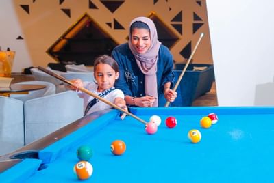 Mother and son playing Billiard at Bay La Sun Hotel & Marina