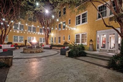 Strings of lights light up a courtyard at Artmore Hotel