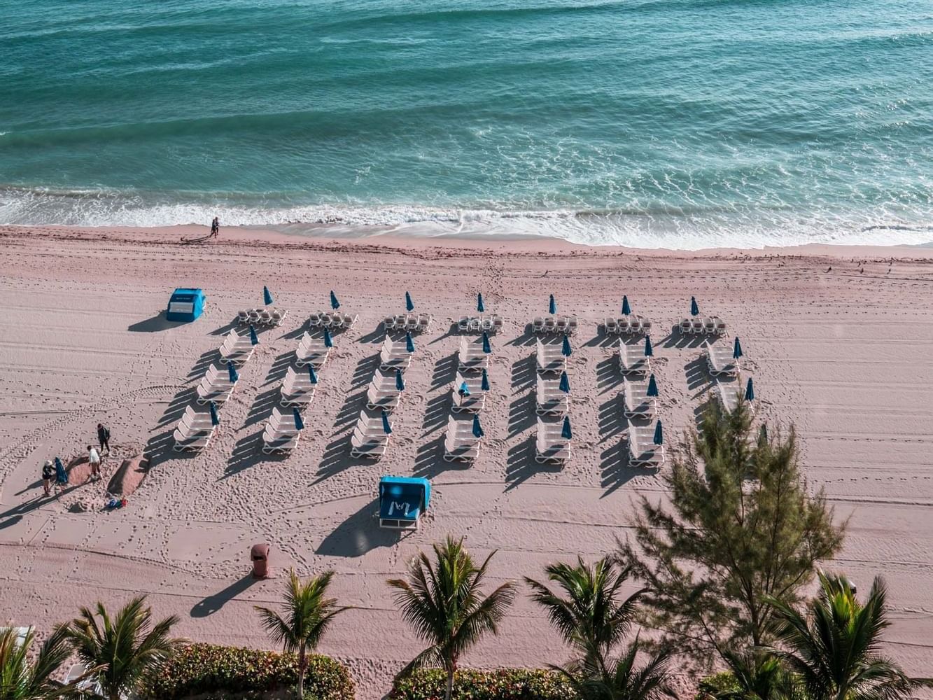 Sun beds by the beach at Marenas Resort Miami